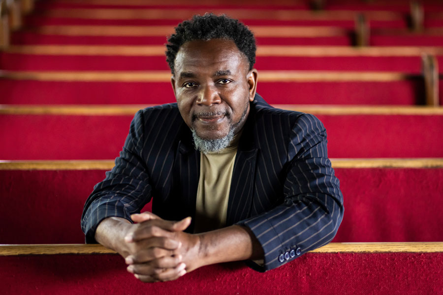 Rev. Ira Acree sits inside Greater St. John Bible Church on the West Side, Tuesday, July 25, 2023.