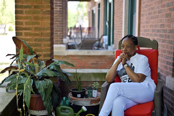 Portrait of Deborah Payne, a lifelong activist who is dedicated to improving Chicago’s South Side, sits on the front porch of her apartment in the Bronzeville neighborhood.